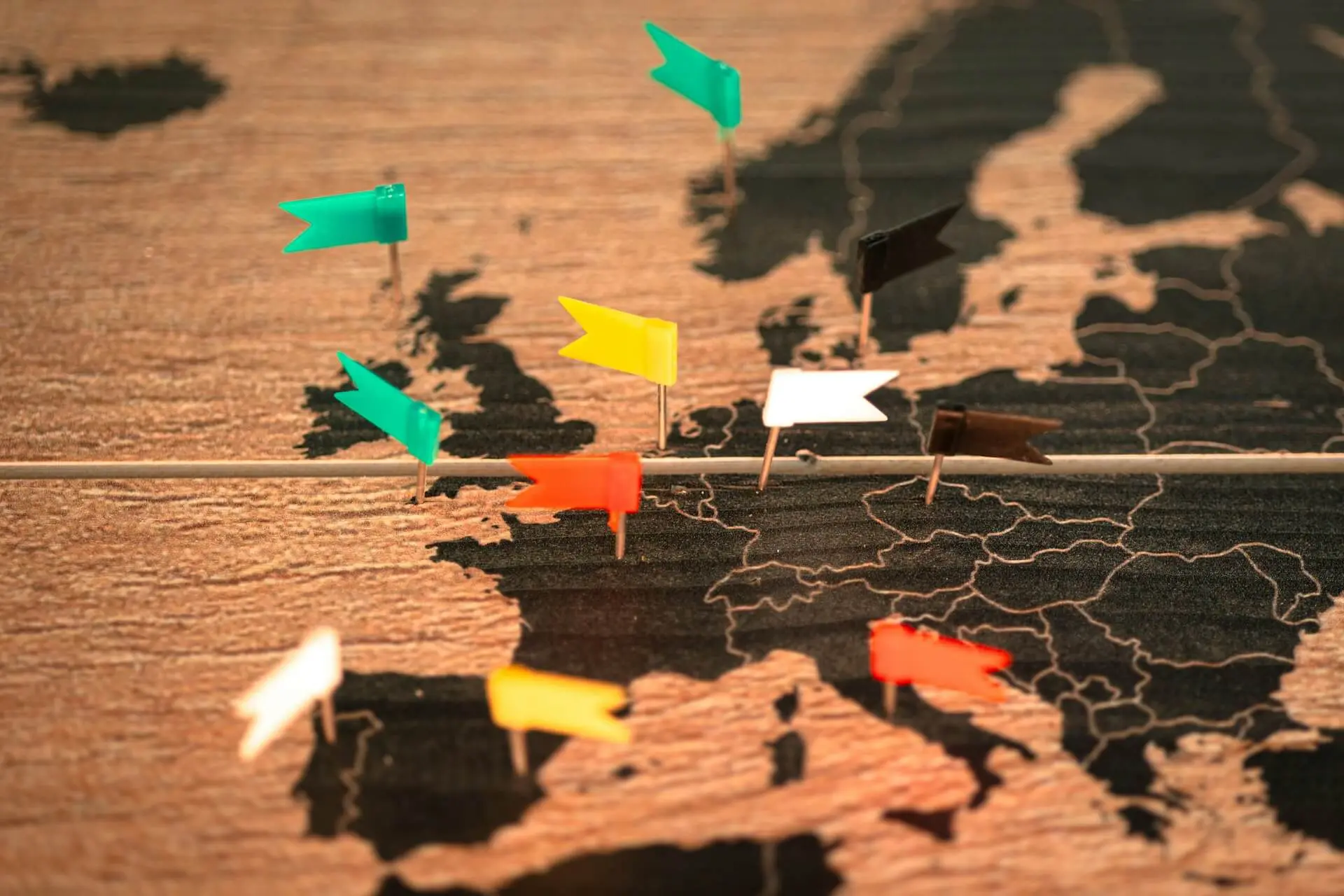 World map with pins symbolizing solo travel in your 20s as an investment in confidence, adaptability, and cultural awareness.