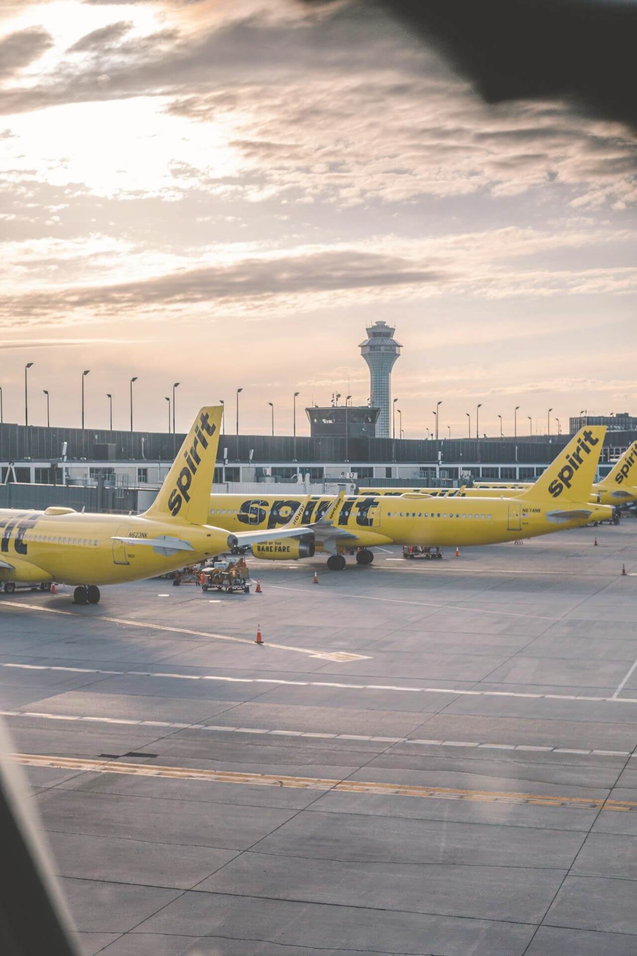 Spirit Airlines budget plane on the runway representing cheap flight options for young travelers.