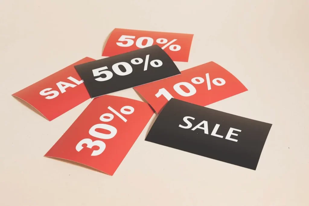 Percentage sign and sale banner representing discounts for young adults