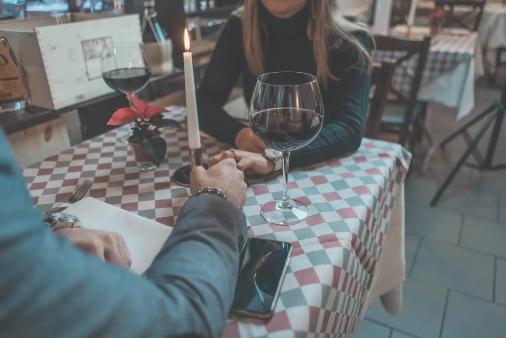 Two people on a date. This article covers 7 things no one tells you about dating in your 20s.